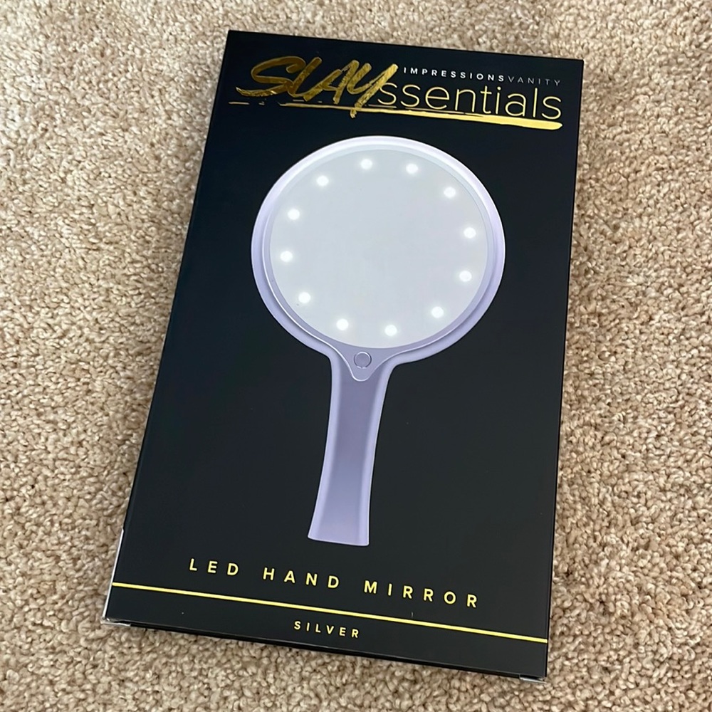 Impressions vanity led hand mirror